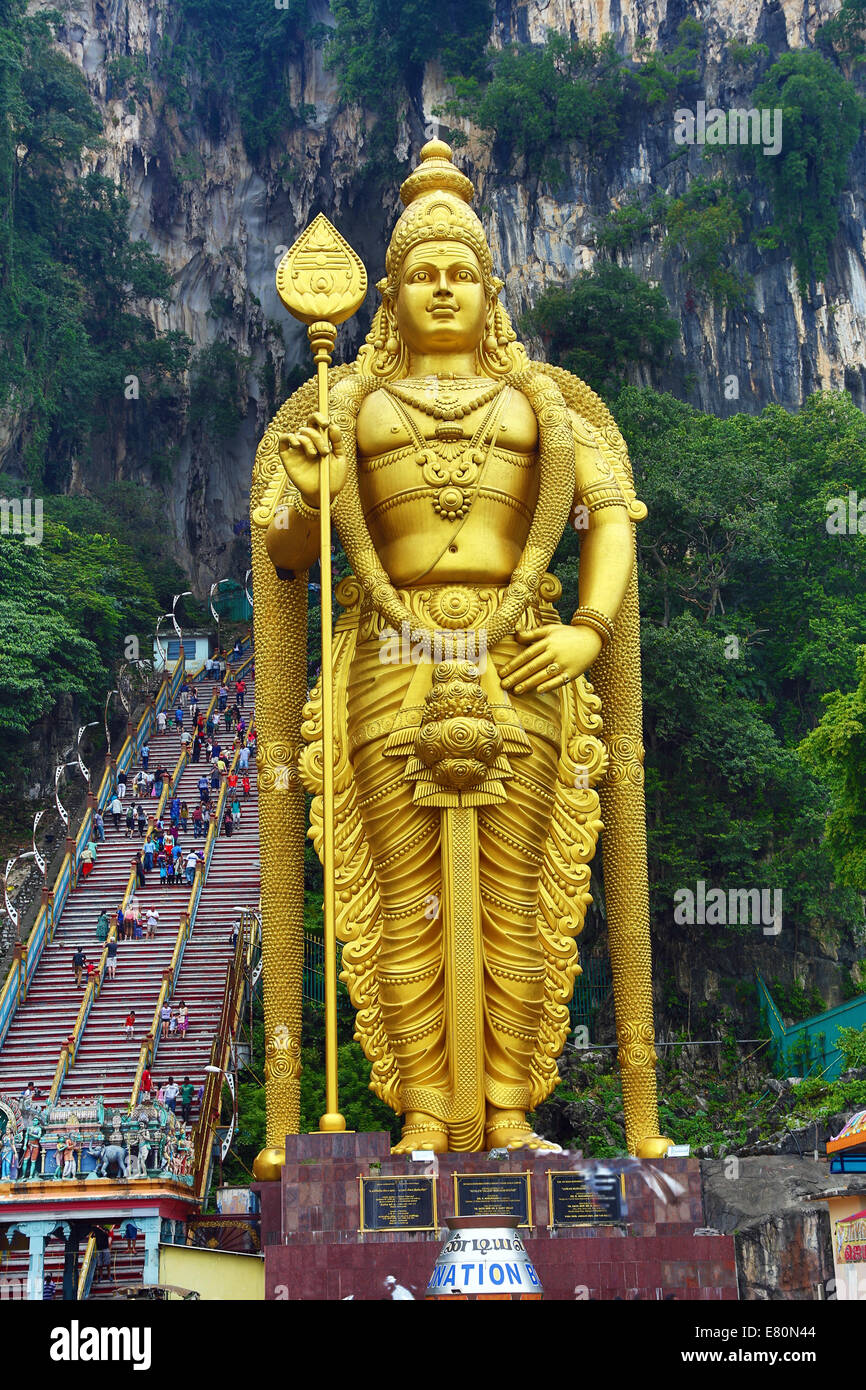 Giant golden statue of the god Murugan at the entrance of the Batu Caves, a Hindu shrine in Kuala Lumpur, Malaysia Stock Photo