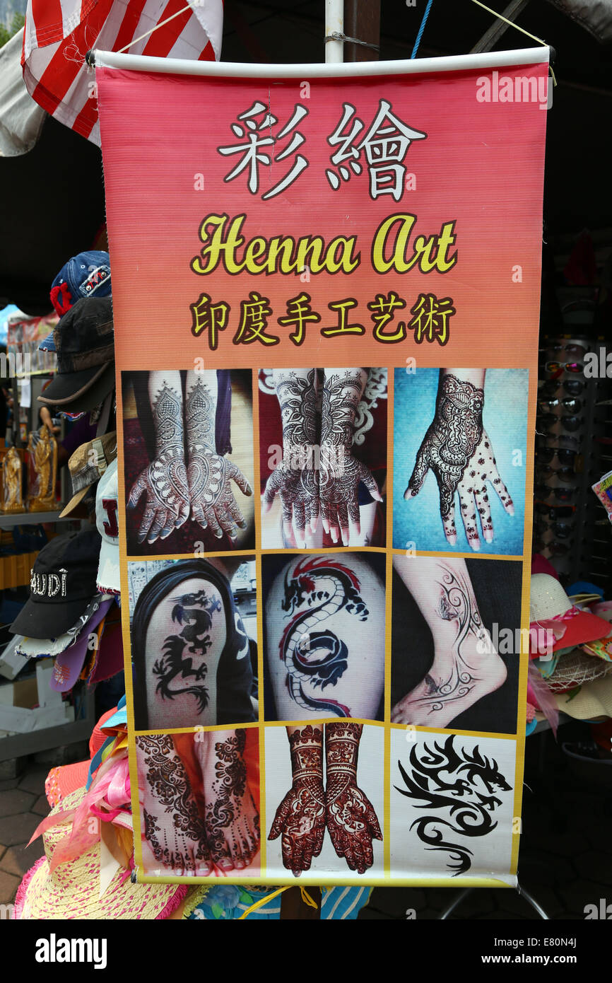Henna art tattoos poster outside the Batu Caves, a Hindu shrine in Kuala Lumpur, Malaysia Stock Photo