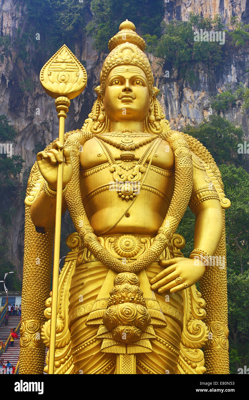 Giant golden statue of the god Murugan at the entrance of the Batu ...