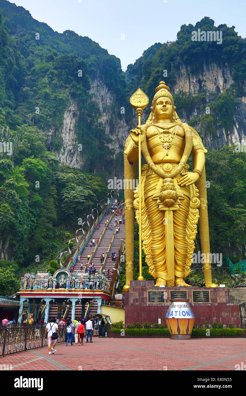 Giant golden statue of the god Murugan at the entrance of the Batu Caves, a Hindu shrine in Kuala Lumpur, Malaysia Stock Photo