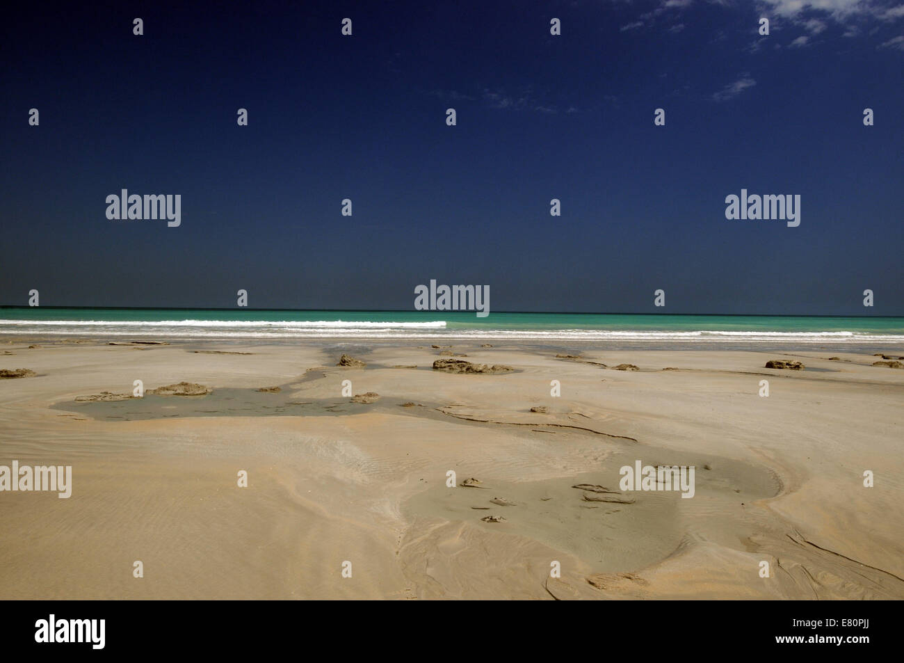 Freshwater running out over Cable Beach in Broome at low tide, Kimberley region, Western Australia Stock Photo