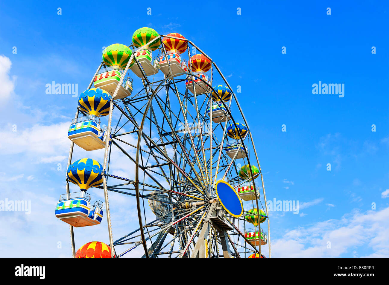 Ferris wheel on the background of blue sky with cloud Stock Photo - Alamy