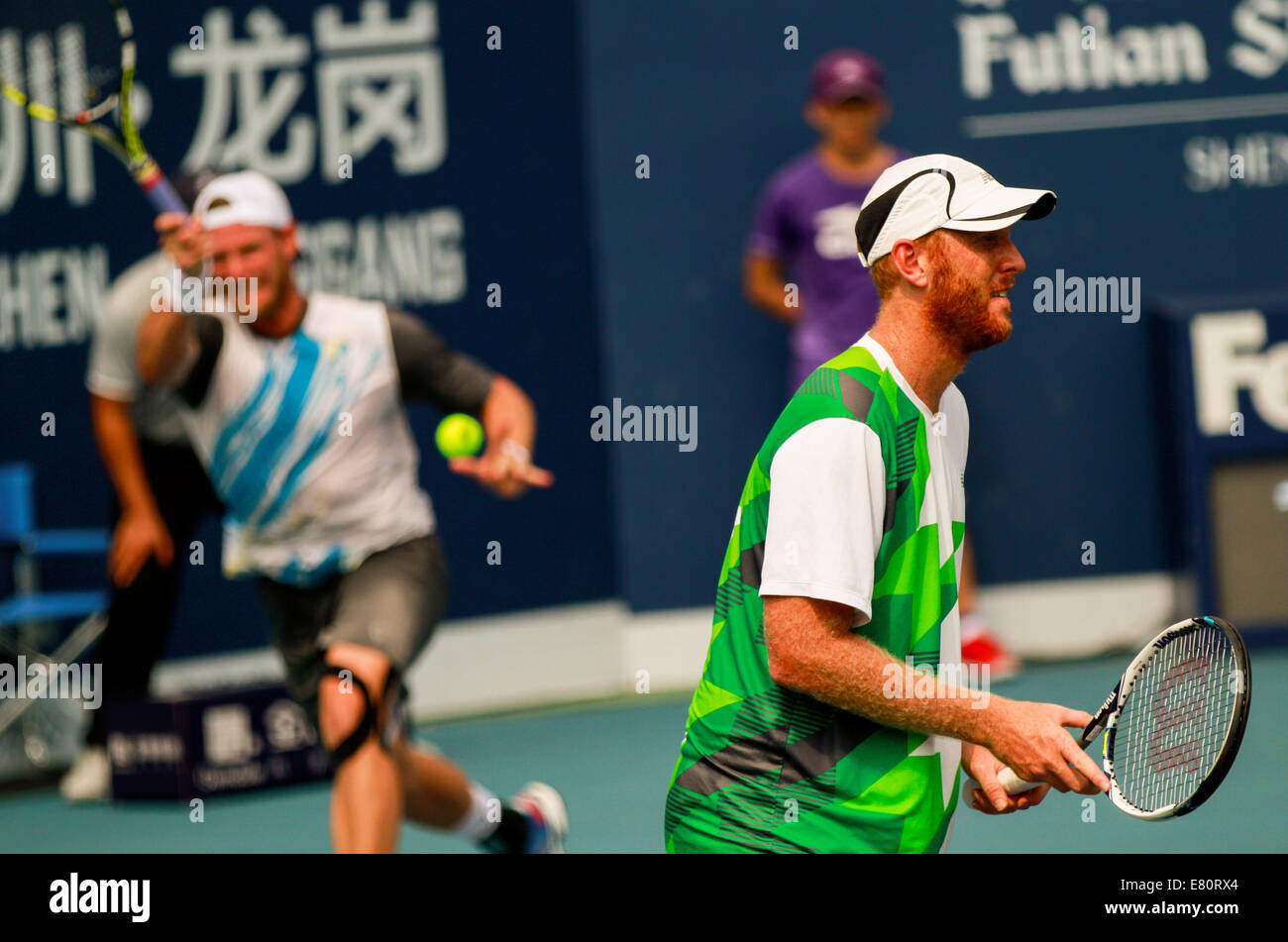 Shenzhen, China's Guangdong Province. 28th Sep, 2014. Sam Groth (L) and Chris Guccione of Australia compete during the men's doubles final match against Jean-Julien Rojer of Netherlands and Horia Tecau of Romania at the ATP Shenzhen Open tennis tournament in Shenzhen, south China's Guangdong Province, on Sept. 28, 2014. Jean-Julien Rojer and Horia Tecau won 2-0 and claimed the title. Credit:  Mao Siqian/Xinhua/Alamy Live News Stock Photo