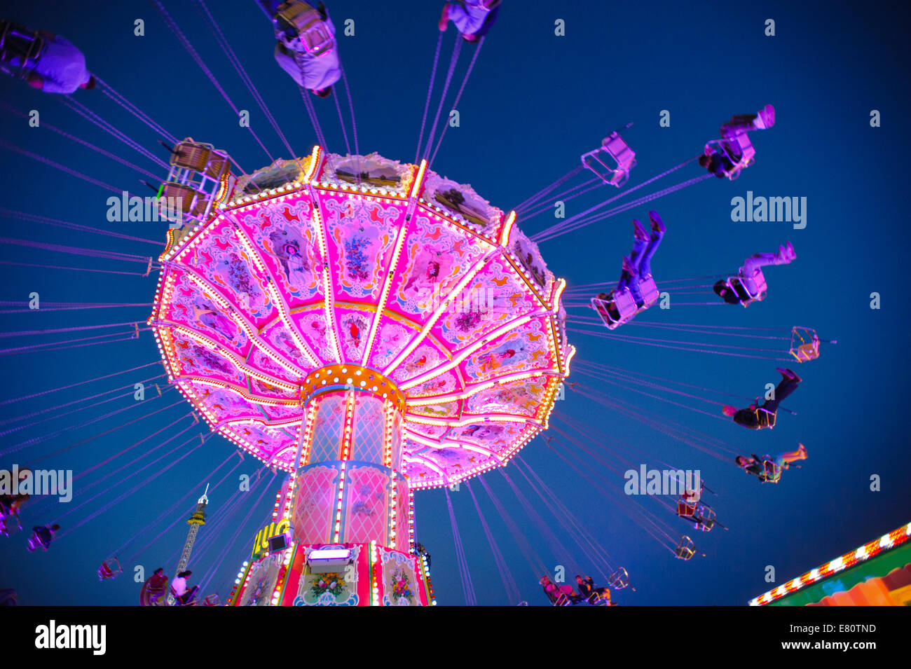 The Oktoberfest in Munich is the biggest beer festival of the world. The visitors have lot of fun with big carousels. Stock Photo