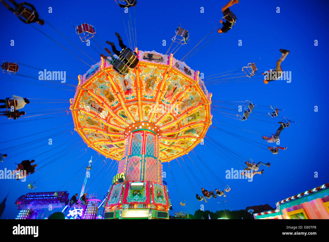 The Oktoberfest in Munich is the biggest beer festival of the world. The visitors have lot of fun with big carousels. Stock Photo