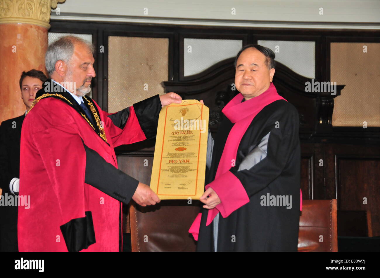 Sofia, Bulgaria. 27th Sep, 2014. Famous Chinese writer Mo Yan displays the certification of the honorary degree Doctor Honoris Causa with Prof. Ivan Ilchev, Rector of the Sofia University in Sofia, Bulgaria, Sept. 27, 2014. Mo Yan, a Chinese writer and Nobel Prize winner, here on Saturday was awarded the honorary degree Doctor Honoris Causa, the highest honor of Sofia University 'St. Kliment Ohridski.' Credit:  Wang Xinran/Xinhua/Alamy Live News Stock Photo