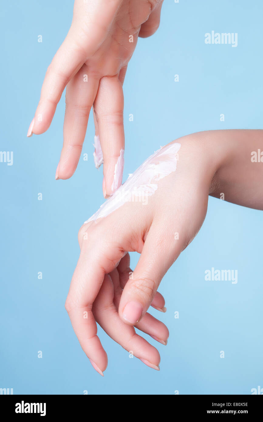 Skincare. Closeup of female hands. Young woman girl taking care of her