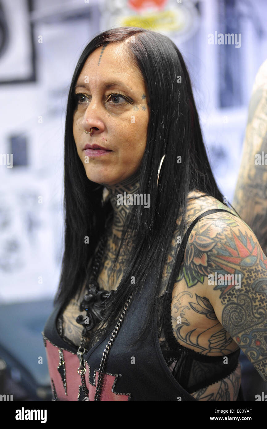 A heavily tattooed woman at the 10th International London Tattoo Convention, Tobacco Dock, London. Stock Photo