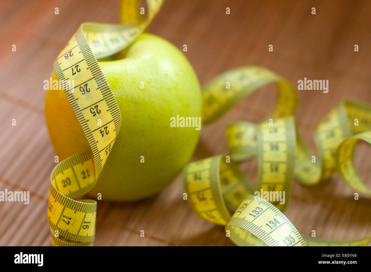 Apple and metric ribbon, symbol for diet and healthy lifestyle Stock Photo