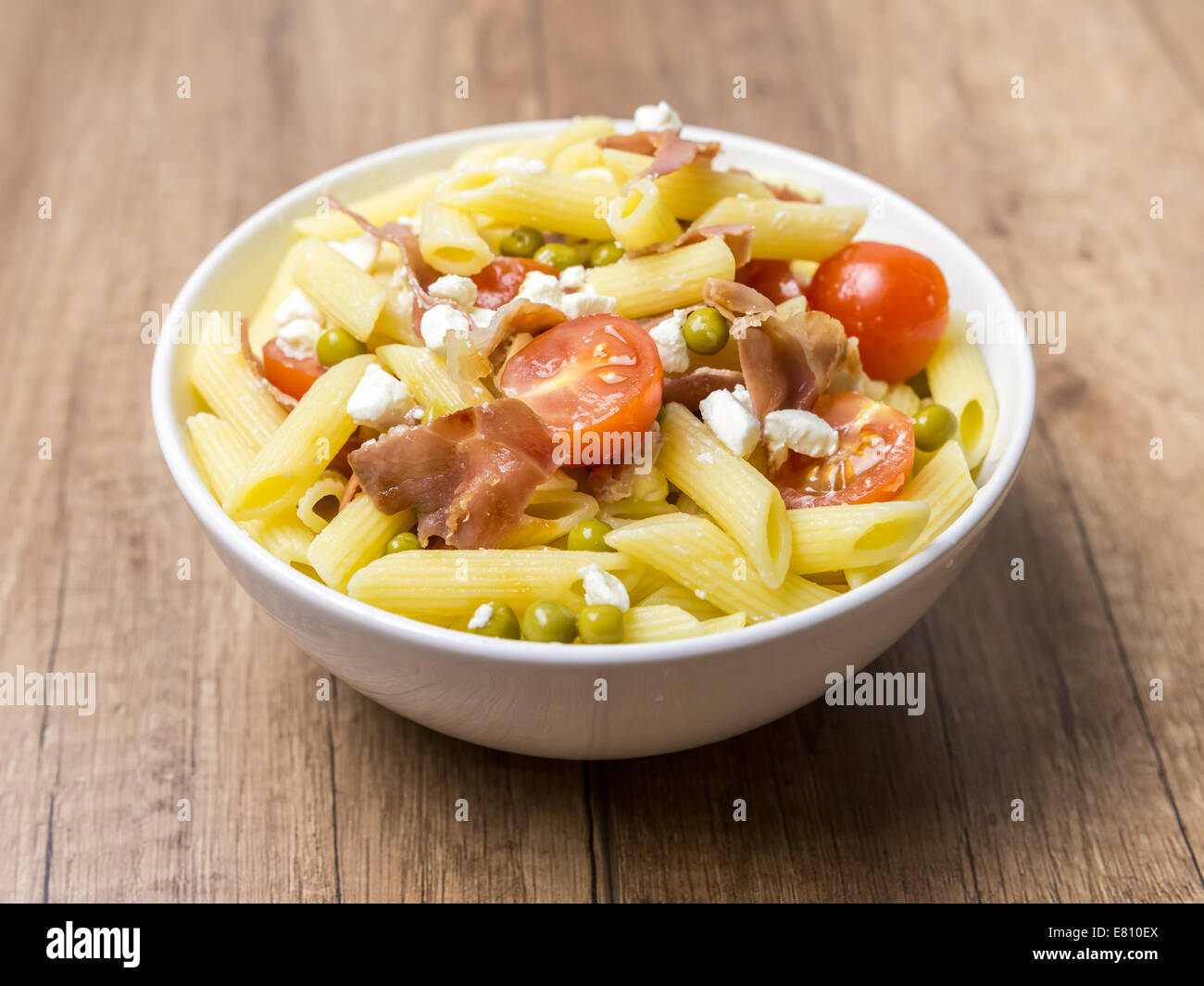 Italian Penne Pasta Salad With Mozzarella, Tomatoes And Prosciutto Ham