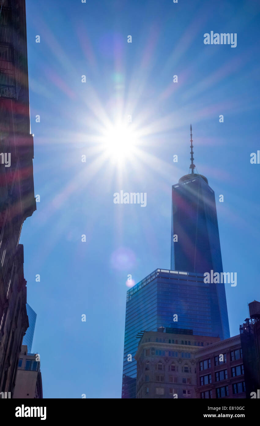 Sun behind the Freedom Tower of the New World Trade Center in Lower Manhattan in New York City Stock Photo