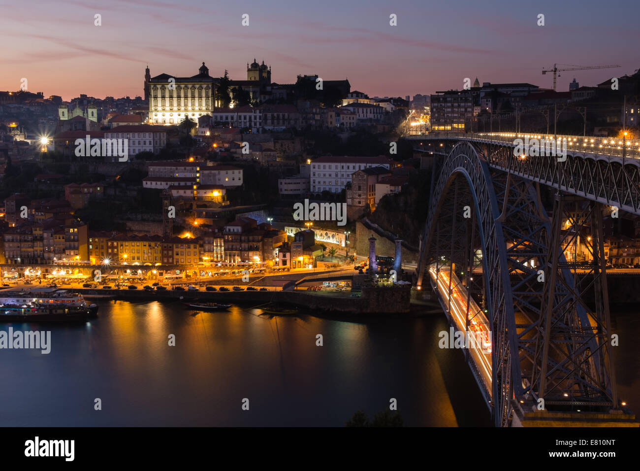 Early evening view of the Ribeira district, Oporto, Portugal with the Luiz I bridge spanning the Douro river. Stock Photo