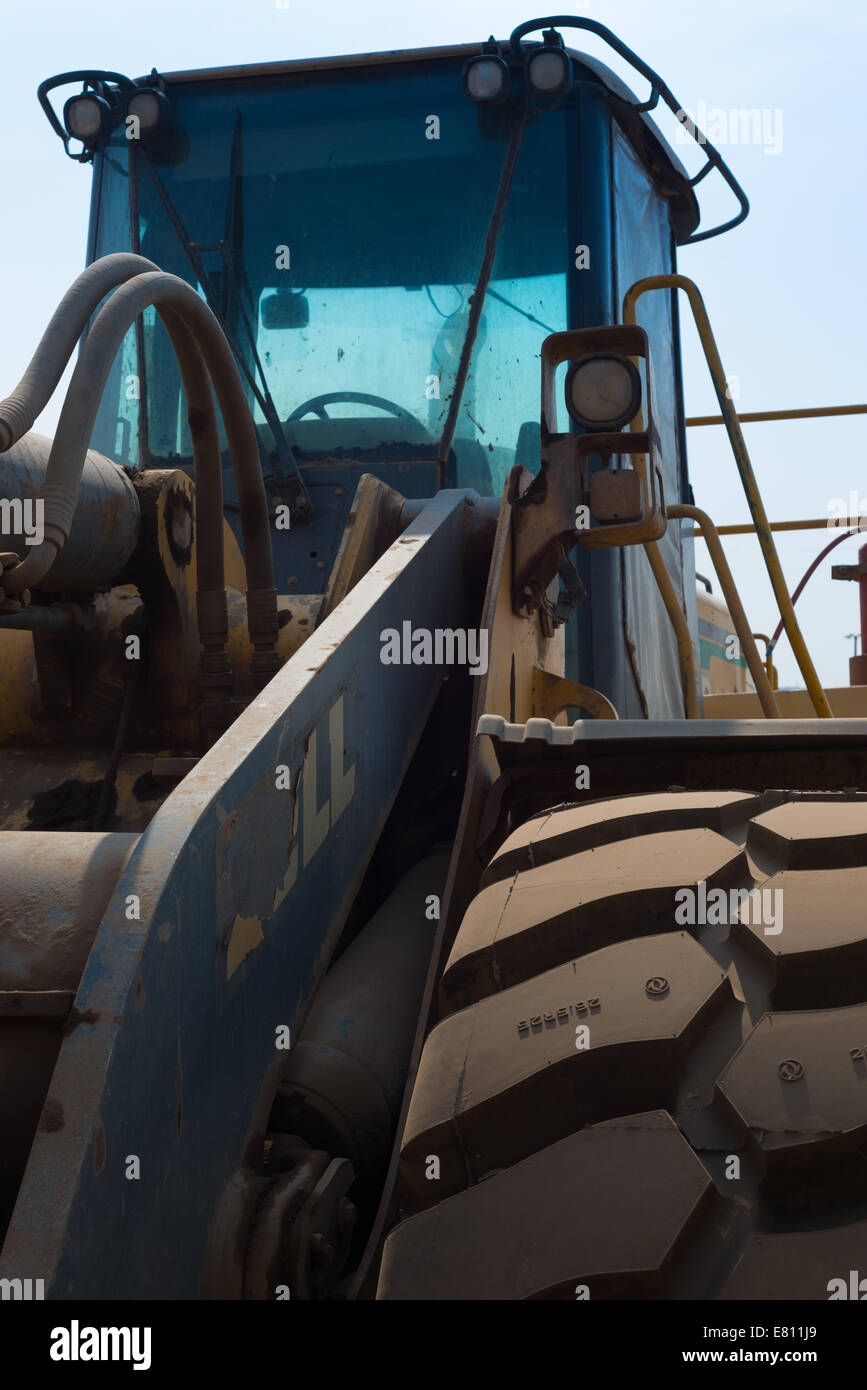 A Bell manufactured front end loader stands unused in a large African open cast copper mine. Stock Photo