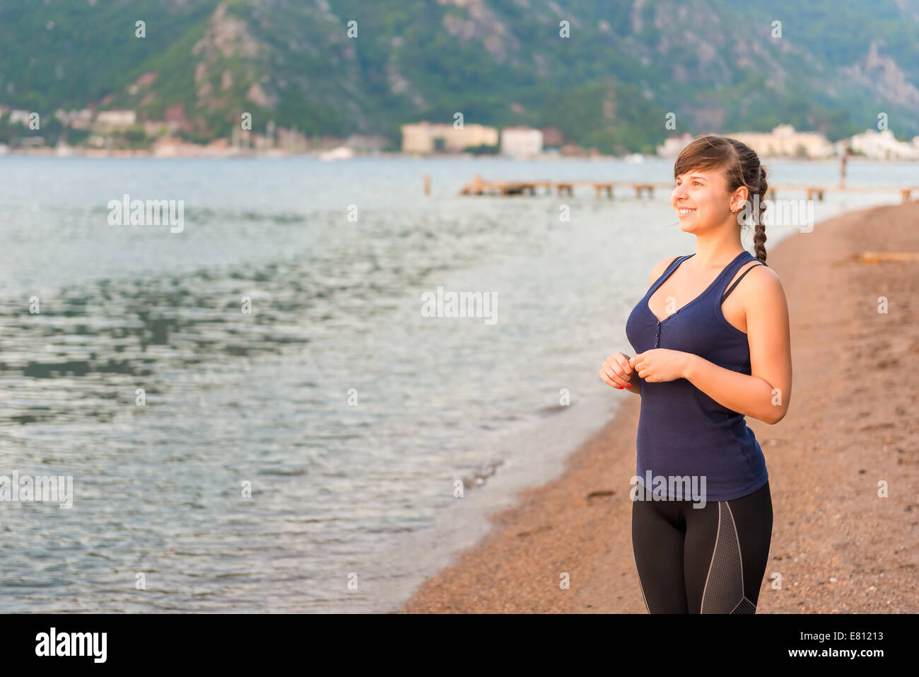 Portrait of brown-haired girl looking at sea Stock Photo