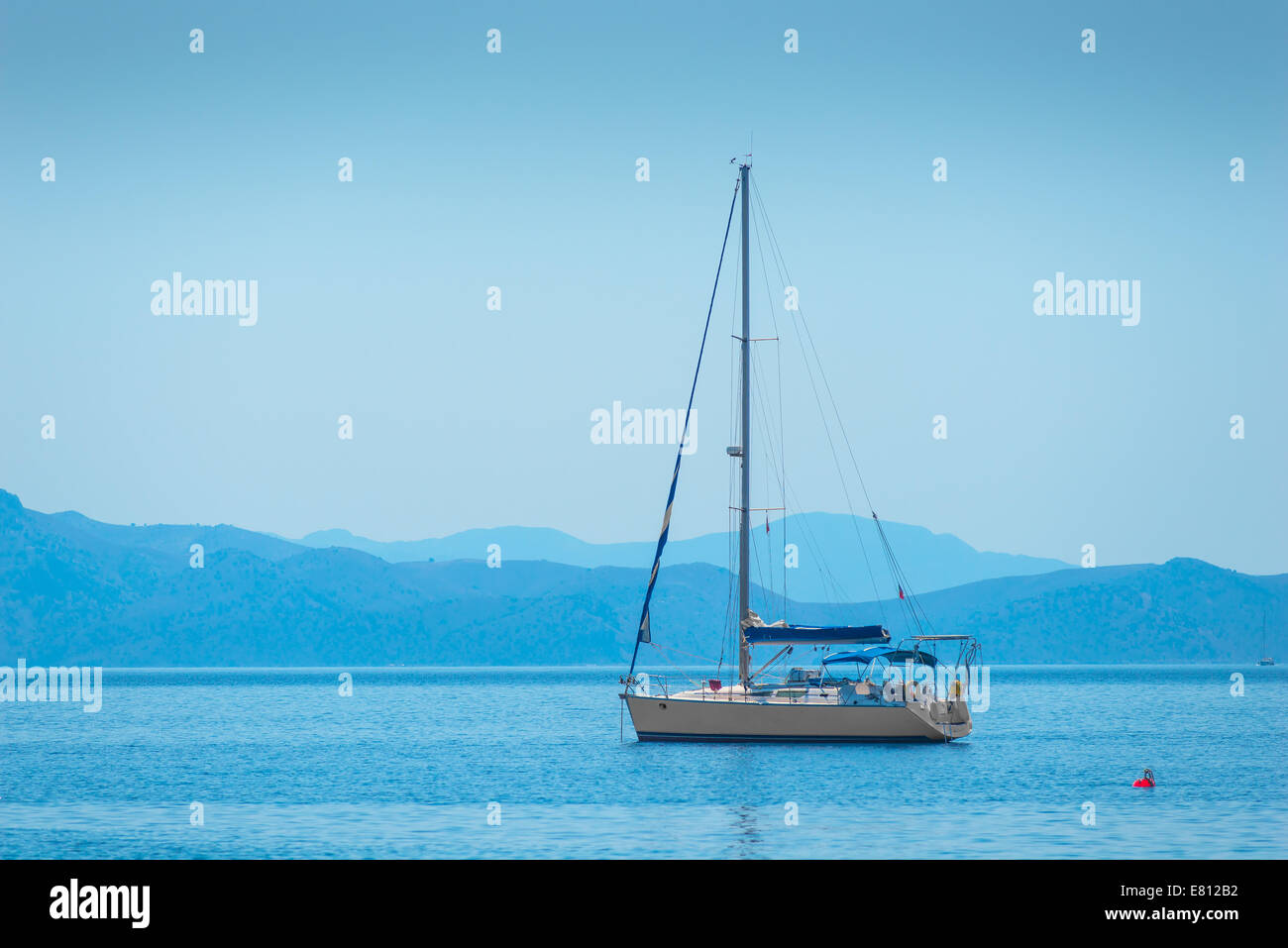 lone sailing yacht drifting in the sea Stock Photo - Alamy