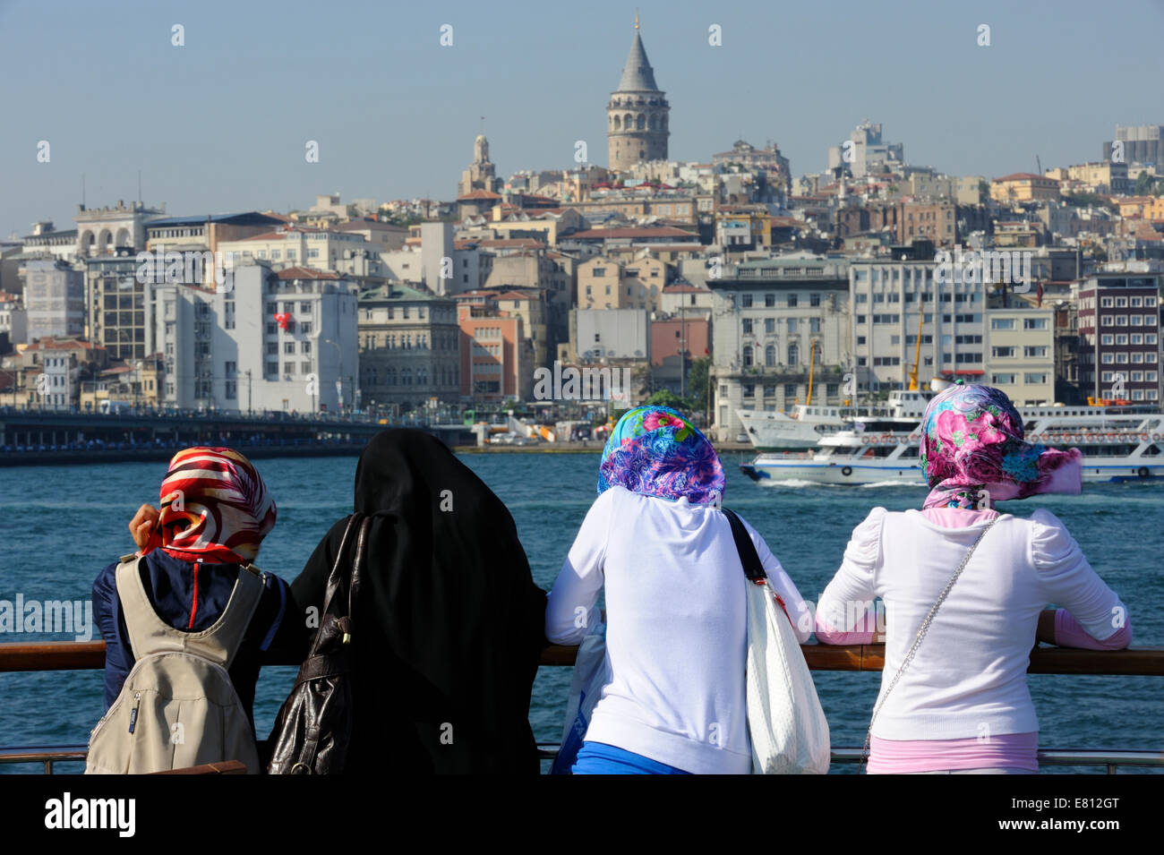Four female passengers on a Bosphorus Ferry approaching Eminonu Stock Photo