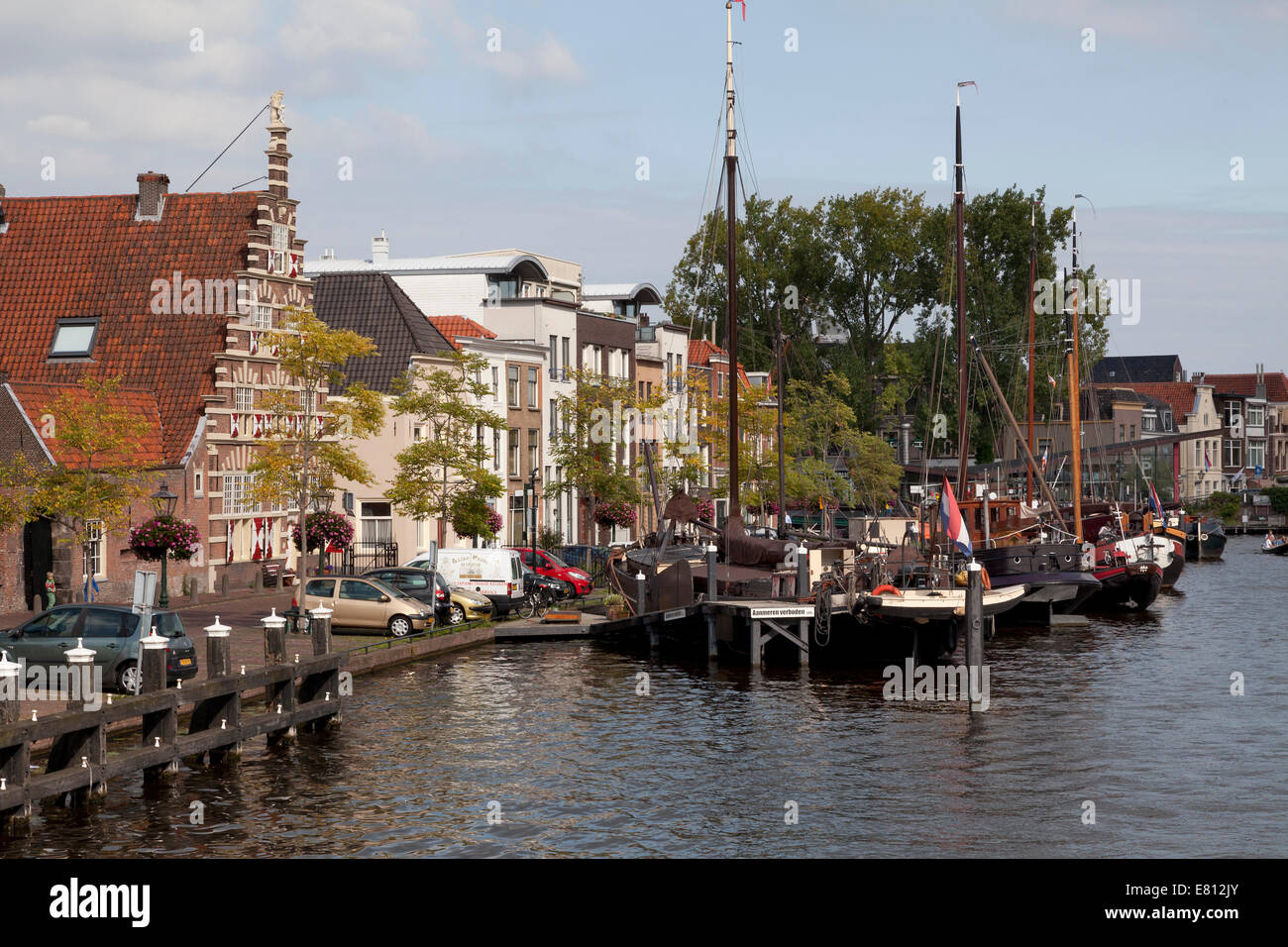 Ships in the historical harbour and the stadstimmerwerf in the city of Leiden, Netherlands Stock Photo