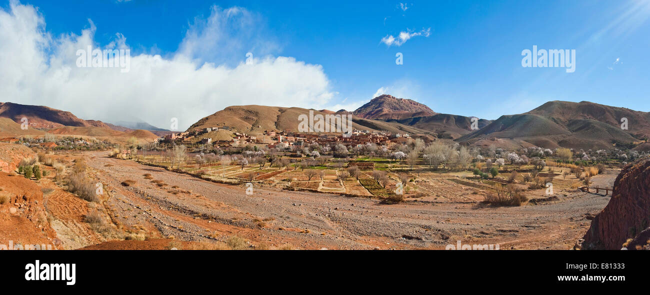 Horizontal panoramic (2 picture stitch) landscape of a traditional Berber mudbrick village in the High Atlas Mountains. Stock Photo