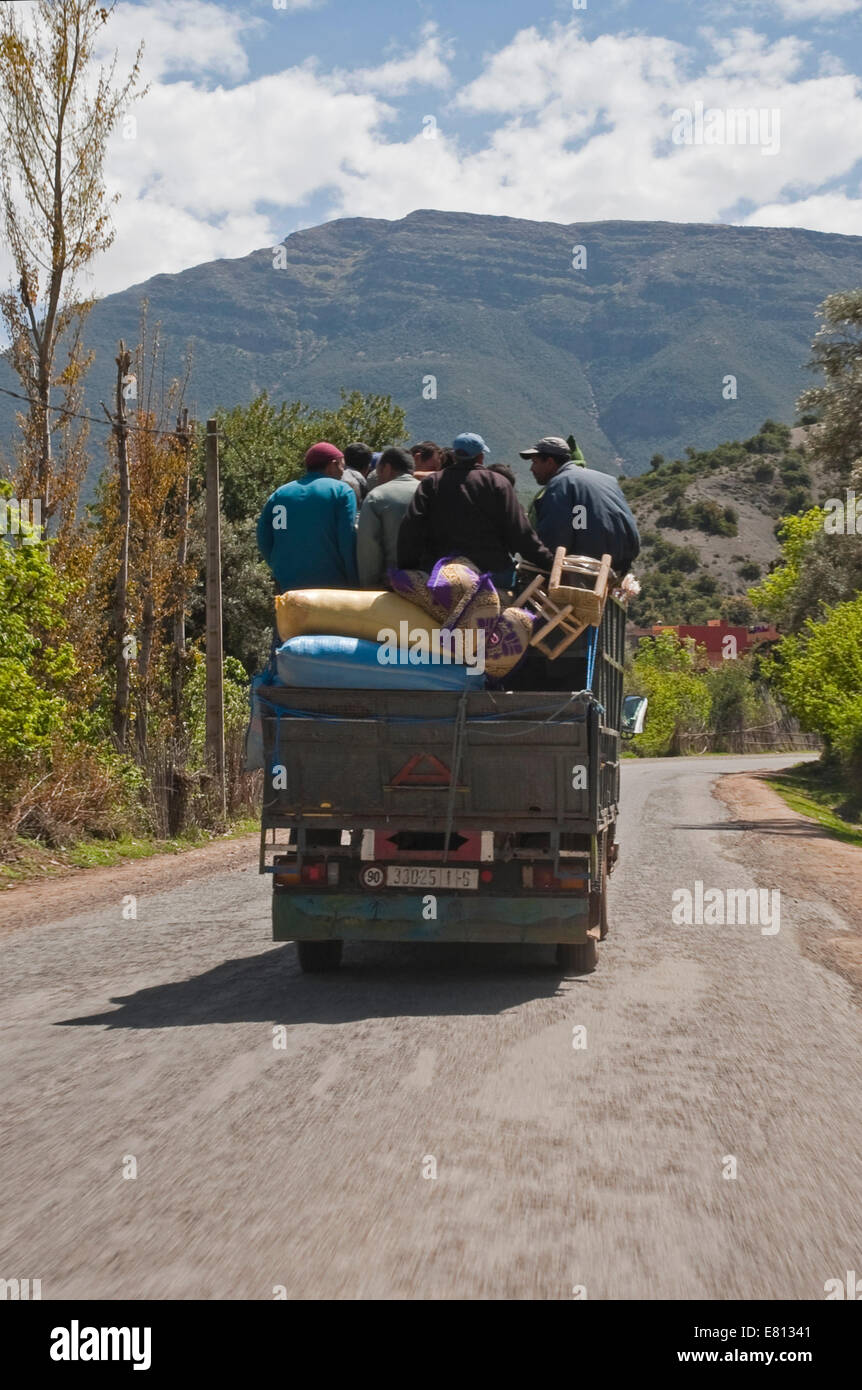 Vertical view of an overloaded truck travelling through the High Atlas Mountain range in Morocco. Stock Photo