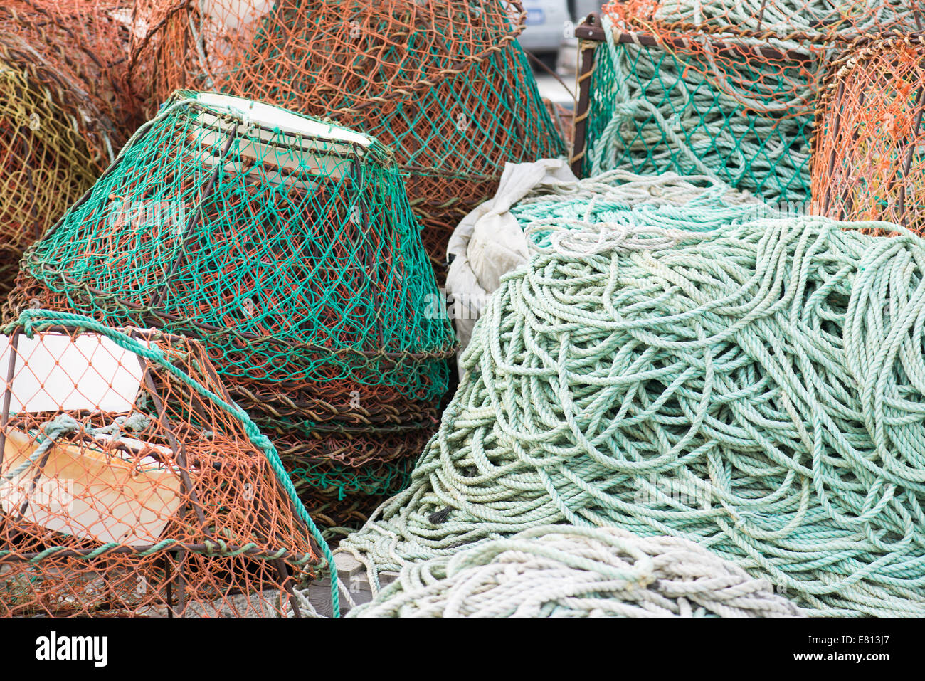 Background of fish nets and fishing equipment in green and orange