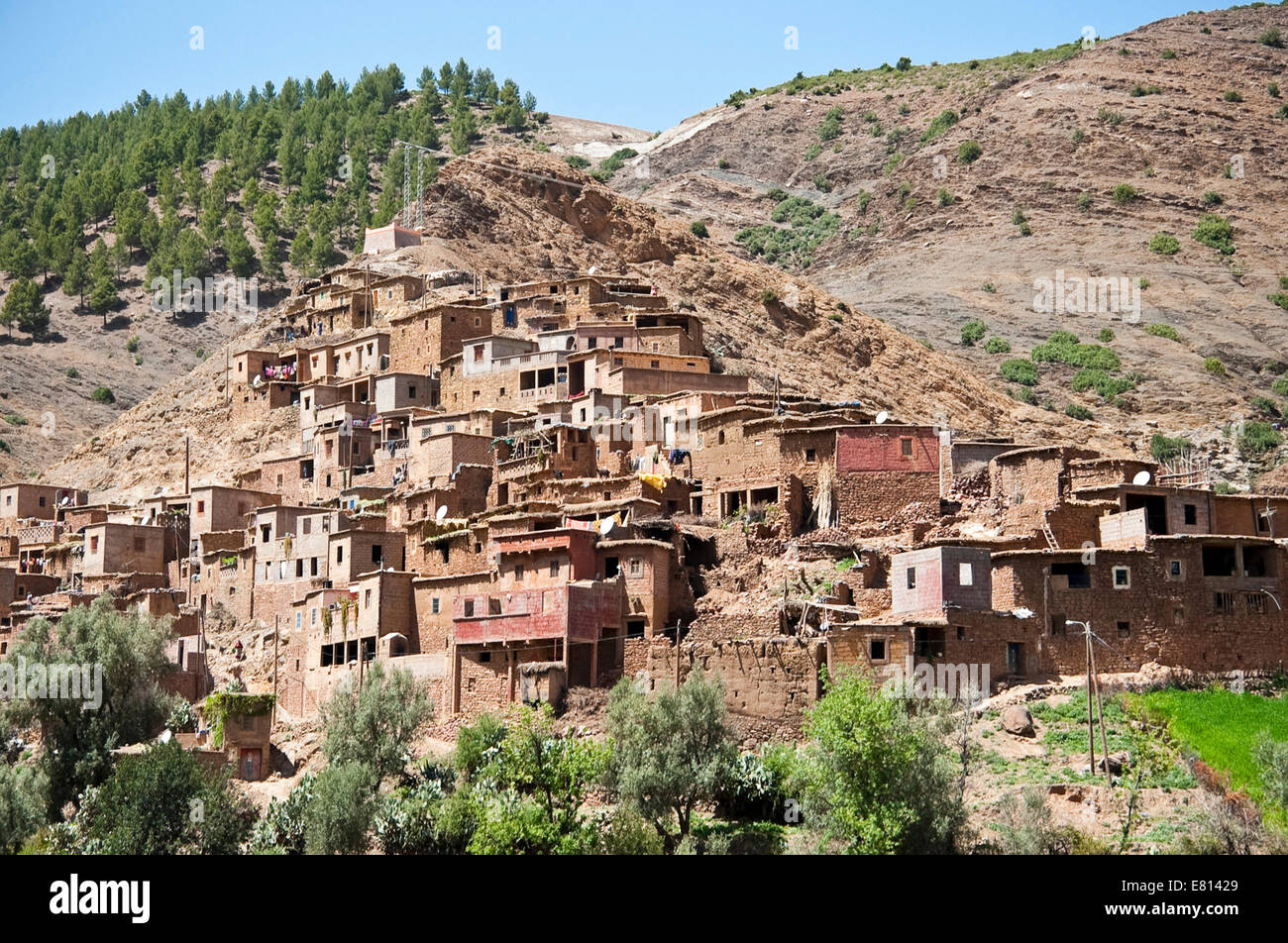 Horizontal view of a traditional mudbrick Berber village in the foothills of the High Atlas Mountain range in Morocco. Stock Photo