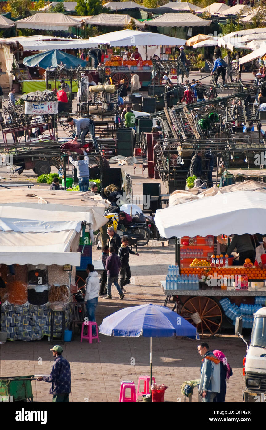 Vertical view of food stall holders setting up in Place Jemaa el-Fnaa in Marrakech. Stock Photo
