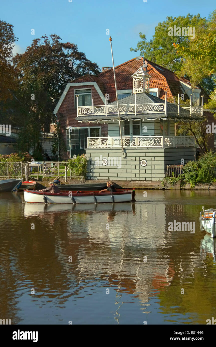 Boating on 't Havenrak in Broek in Waterland, a charming, historic village, in North Holland, The Netherlands. Stock Photo
