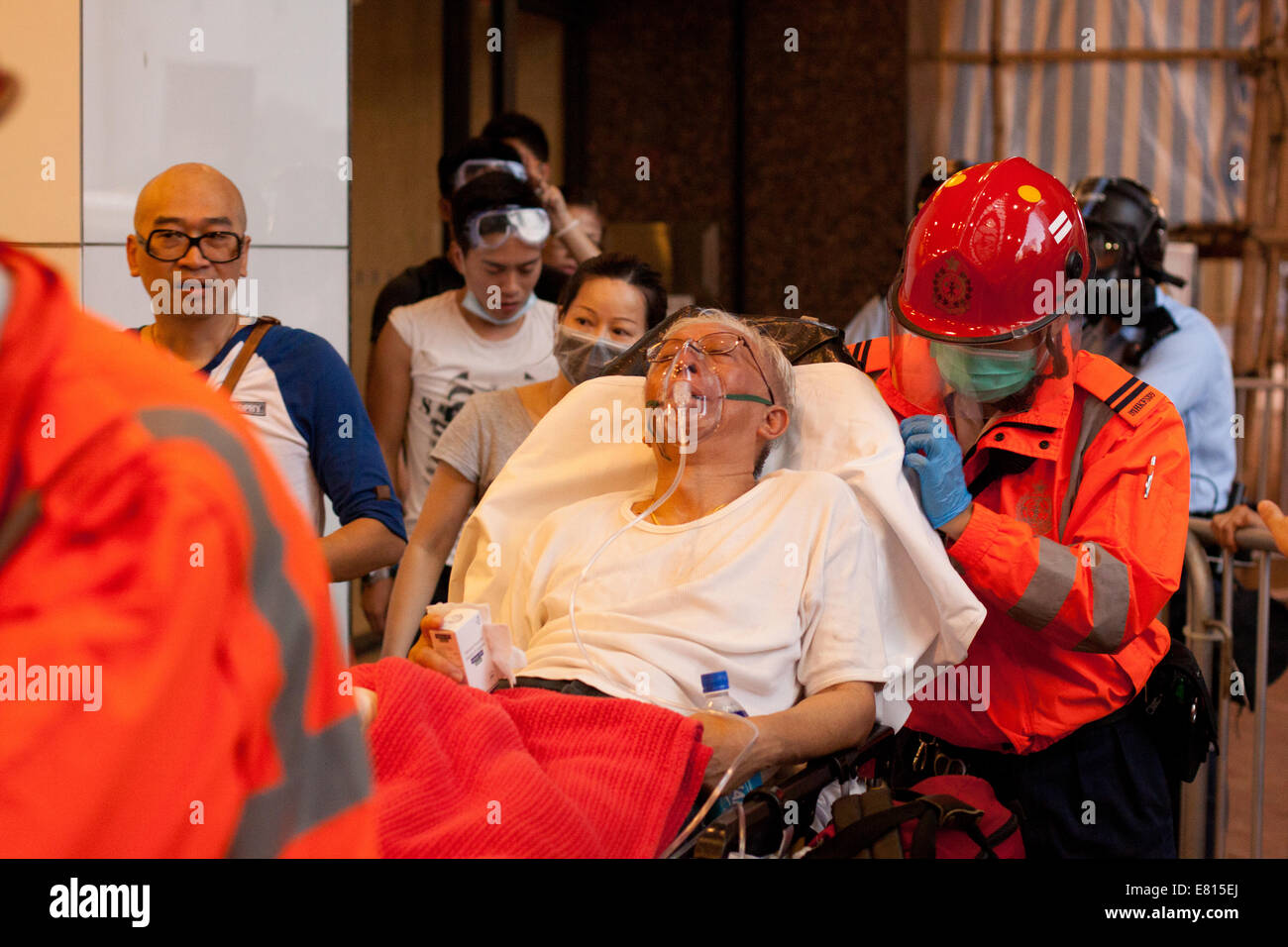 Hong Kong. 28th Sep, 2014. Elderly person attended to by medical staff, after tear gas fired during Occupy Central protests, Hong Kong, China.   Protests against decision by Beijing to offer Hong Kong voters, to choose their Chief Executive in 2017 elections from approved candidates, rather than an open list. Credit:  SCWLee/Alamy Live News Stock Photo