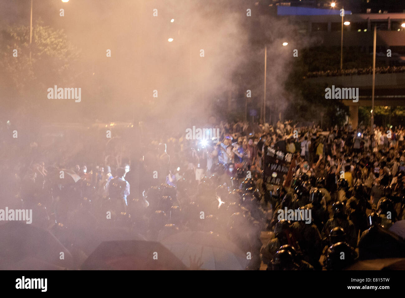 Hong Kong. 28th Sep, 2014. Tear gas fired during Occupy Central protests, Hong Kong, China.   Protests against decision by Beijing to offer Hong Kong voters, to choose their Chief Executive in 2017 elections from approved candidates, rather than an open list. Credit:  SCWLee/Alamy Live News Stock Photo
