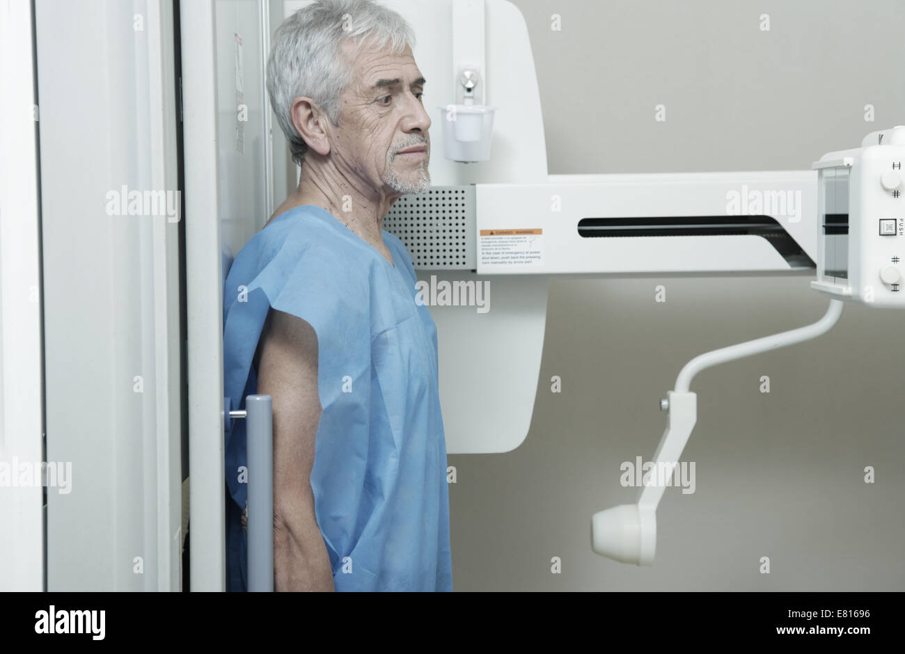 Man in 70s undergoing x-ray scan. Stock Photo