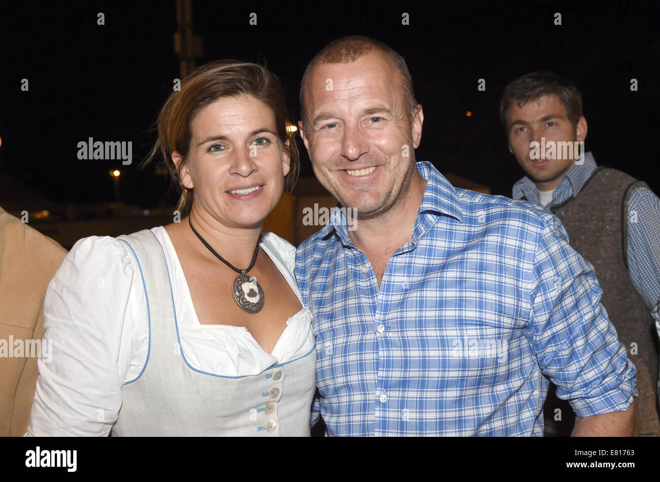 Actor Heino Ferch celebrates with his wife Marie-Jeanette at the 'Kaefer tent' during the Oktoberfest 2014 in Munich (Bavaria), Germany, 27 September 2014. PHOTO: FELIX HOERHAGER/dpa Stock Photo