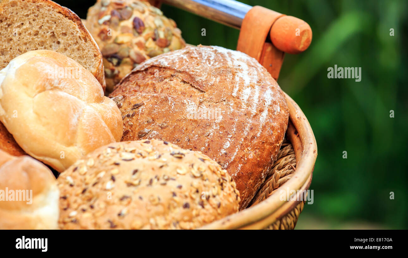 Basket full of different types of bread Stock Photo Alamy