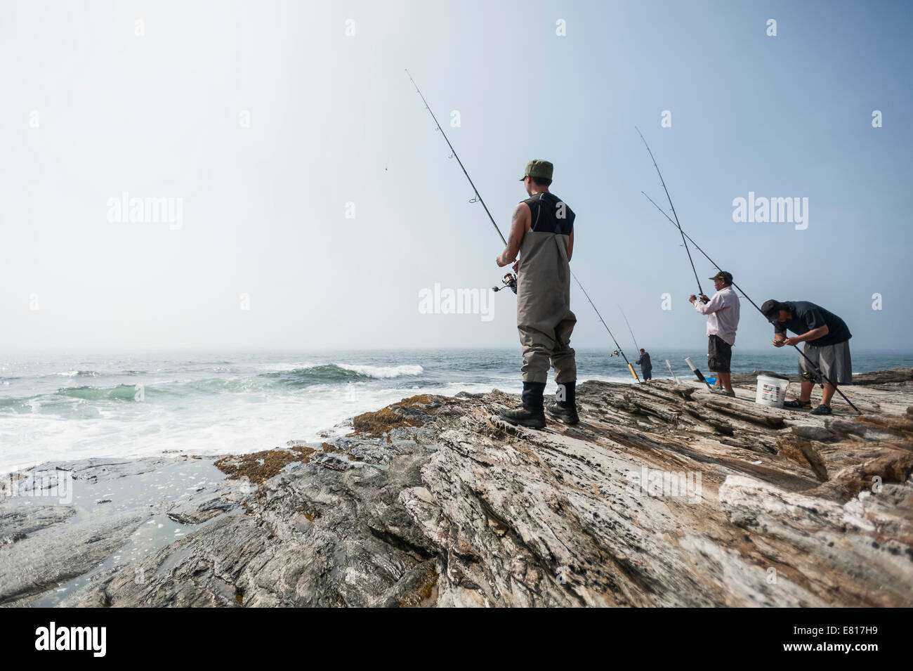Men onshore Ocean fishing on the shores of Point Judith, Rhode Island