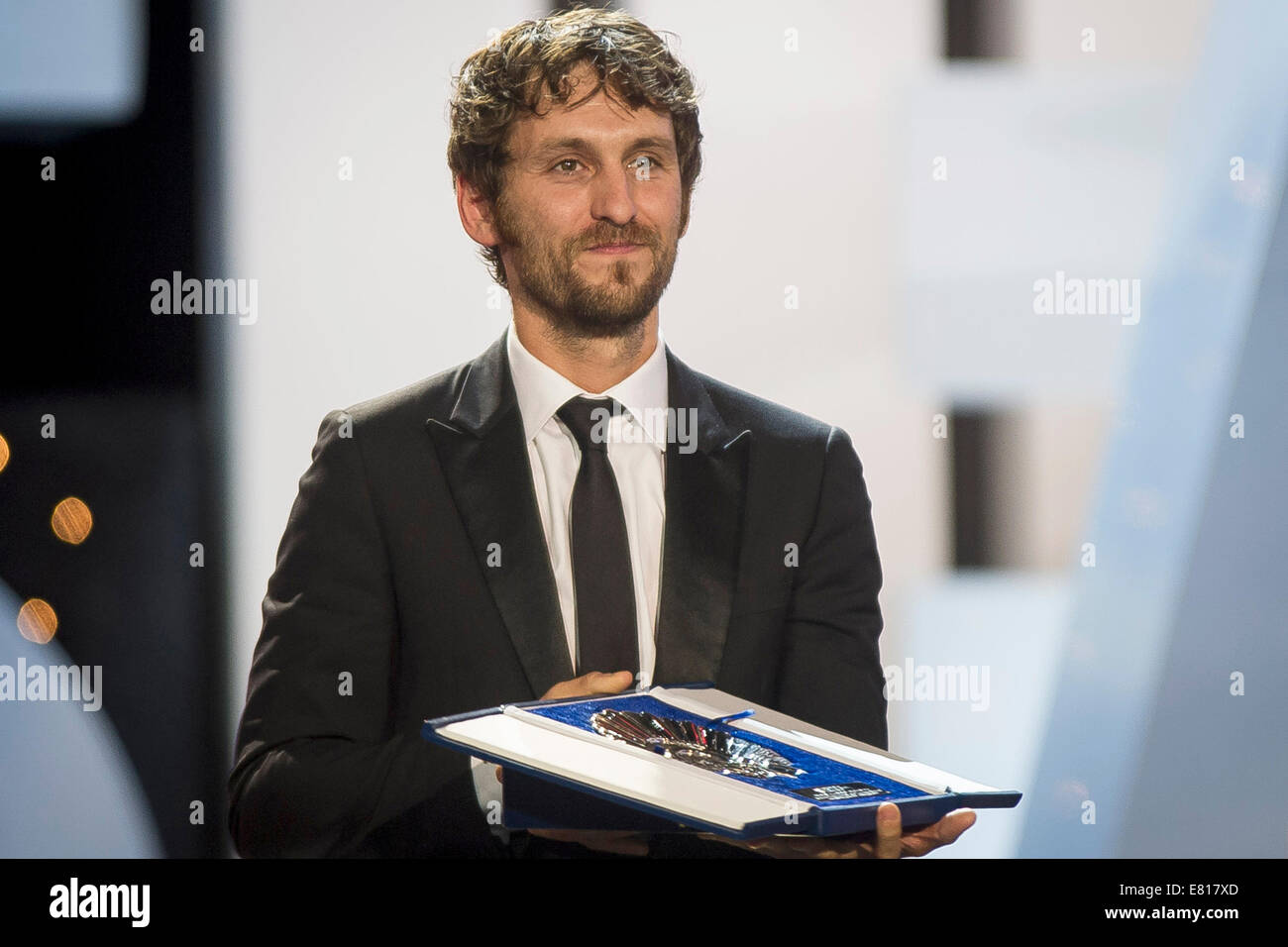 Spanish actor Raul Arevalo accepts the Silver Shell (Concha de Plata) award for best actor on behalf of Spanish actor Javier Gutierrez for his film 'La Isla Minima' at the Kursaal Palace during the 62nd San Sebastian International Film Festival closing ceremony on September 27, 2014 in San Sebastian/picture alliance Stock Photo