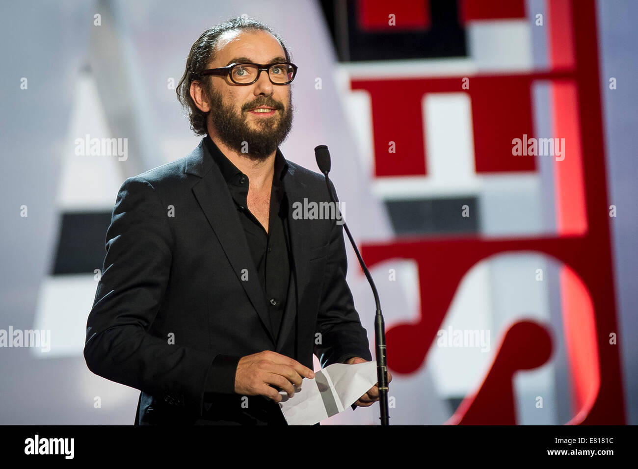 Belgian director Michael R. Roskam holds US novelist and screenwriter Dennis Lehane's award concha de oro for best screenplay for his film 'The Drop' during the 62nd San Sebastian International Film Festival on September 27, 2014/picture alliance Stock Photo