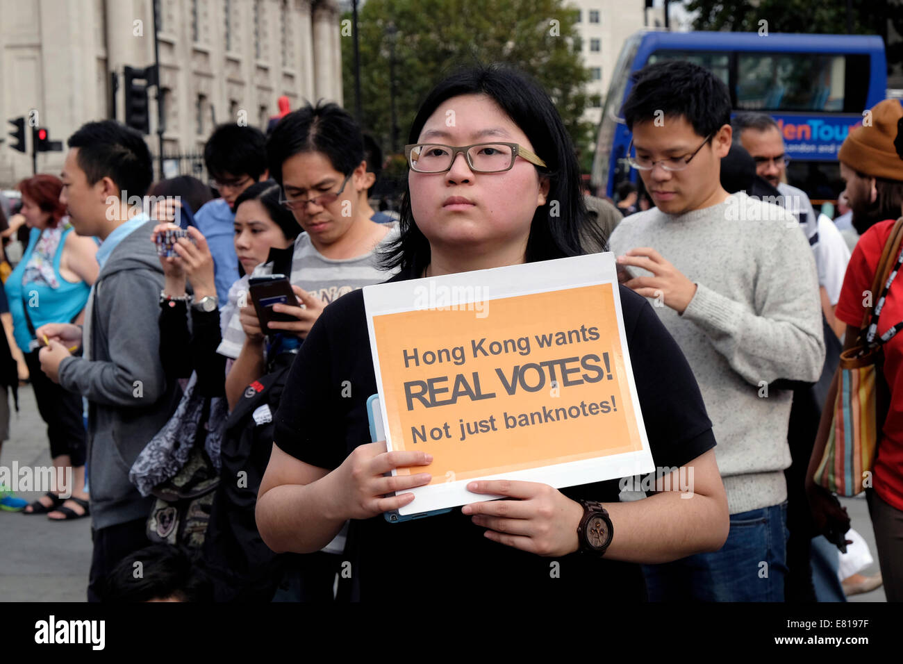 A young woman from Hong Kong holds a placard reading " Hong Kong wants real votes" Stock Photo