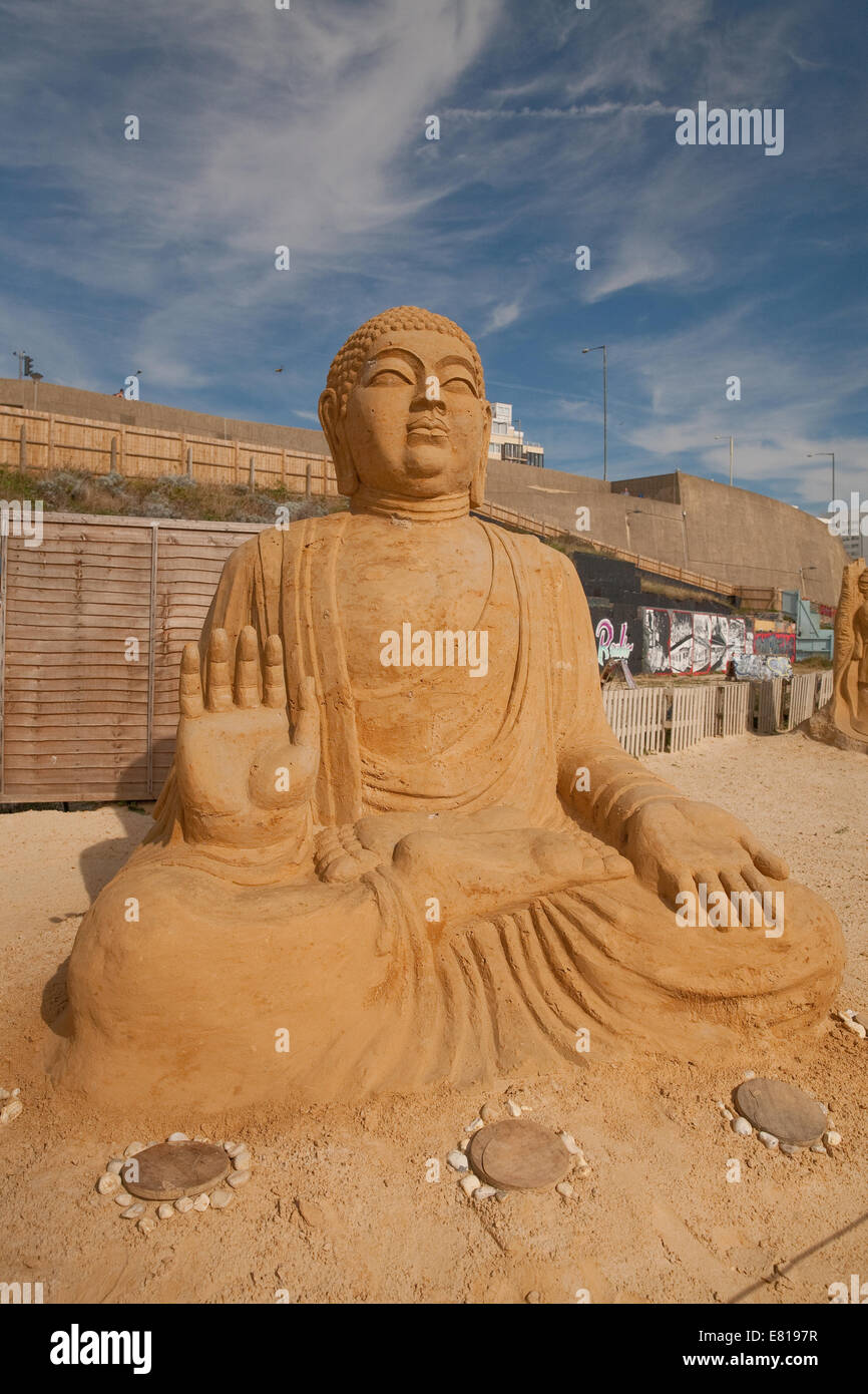 The Tian Tan Buddha from China on display at the Sand Sculpture festival in Brighton Stock Photo