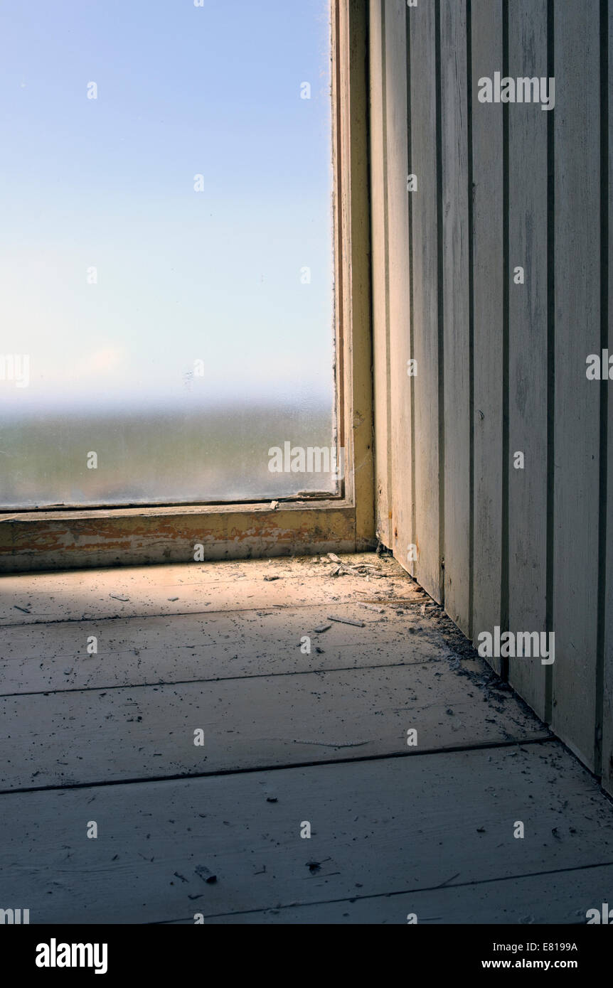 Interior image of a window in an old abandoned building Stock Photo
