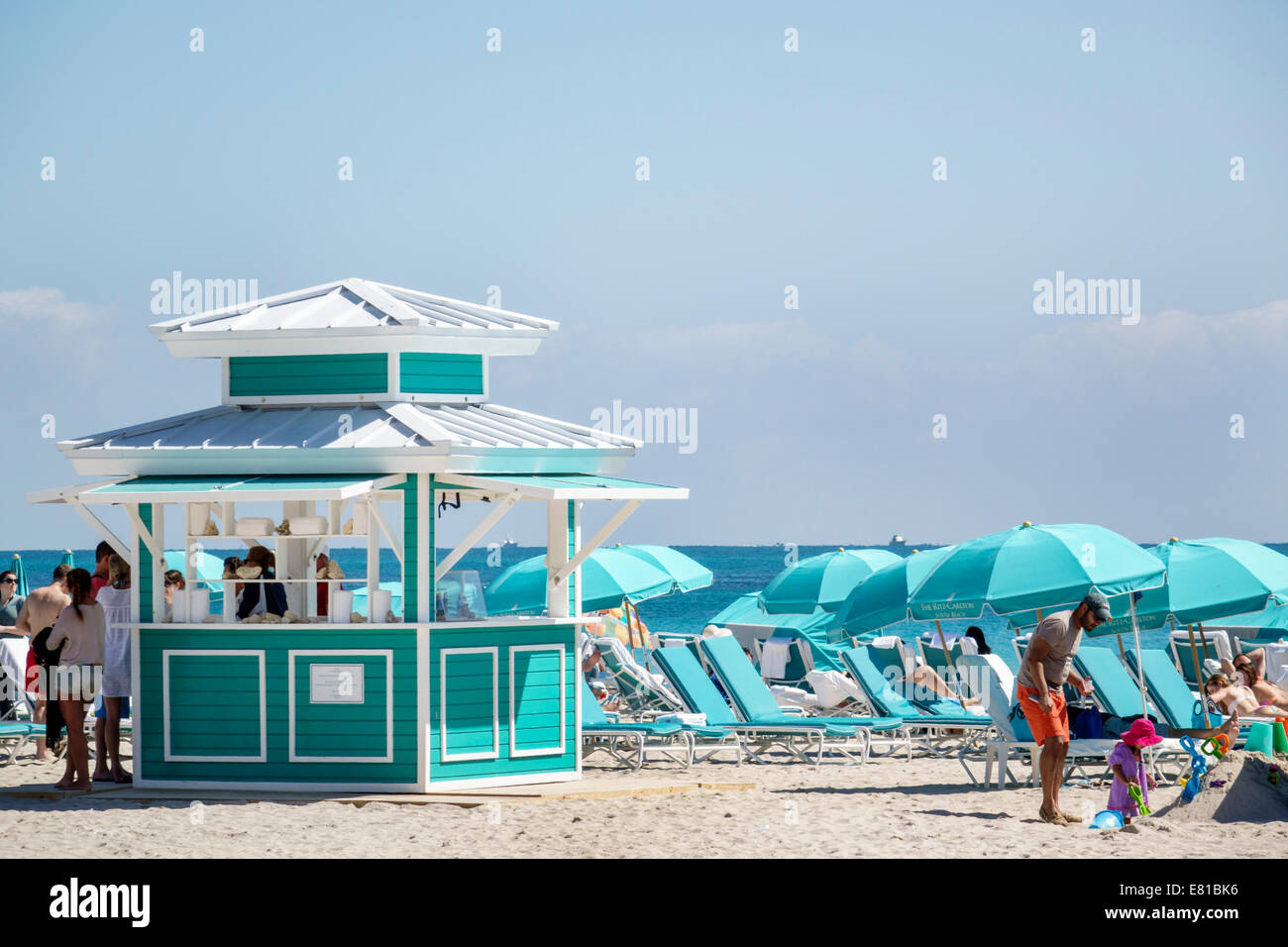 Miami Beach Florida,kiosk,rental,umbrellas,lounge chairs,Atlantic Ocean,FL140305045 Stock Photo