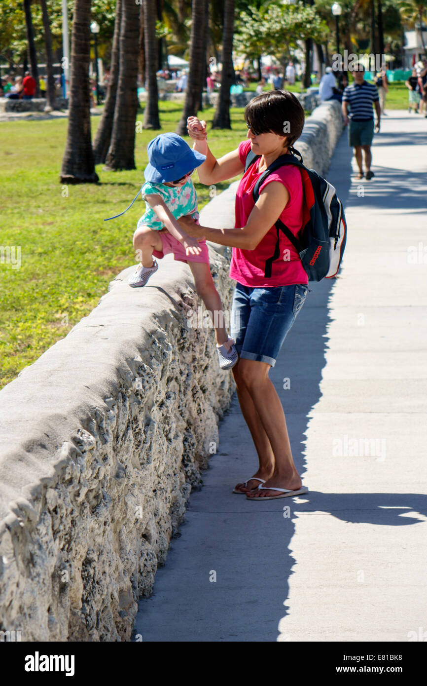 Miami Beach Florida,Ocean Drive,Lummus Park,Serpentine Trail,girl girls,youngster youngsters youth youths female kid kids child children,balancing,wal Stock Photo