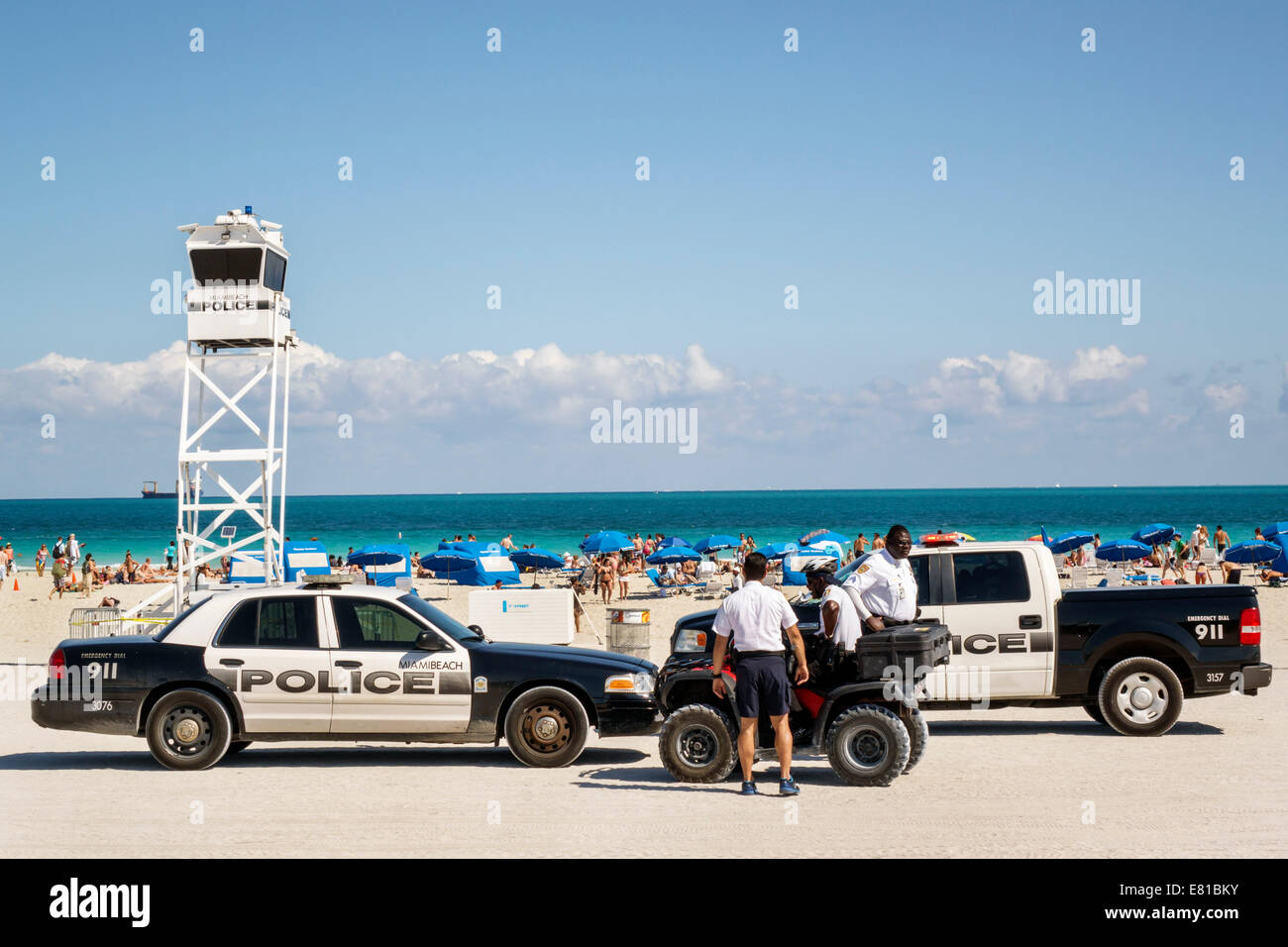 Miami Beach Florida,Atlantic Ocean,police,department,policemen,Black man men male,squad car,pickup truck,portable,surveillance tower,FL140305081 Stock Photo