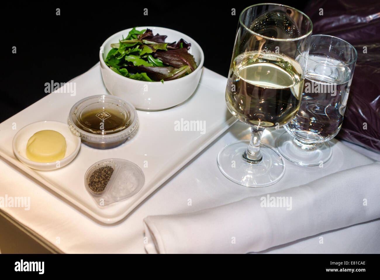 New York,New York,John F. Kennedy International Airport,JFK,onboard,American Airlines,class,tray,salad,glass,wine,water,service,NY140305052 Stock Photo