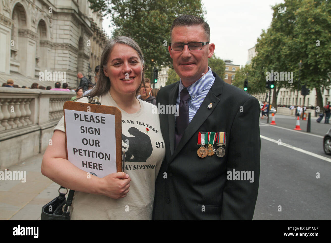 London, UK. 27th Sep, 2014.  Rachel whose husband suffers from the Gulf syndrome poses for photos with a fellow veteran soldier. Credit:  david mbiyu/Alamy Live News Stock Photo