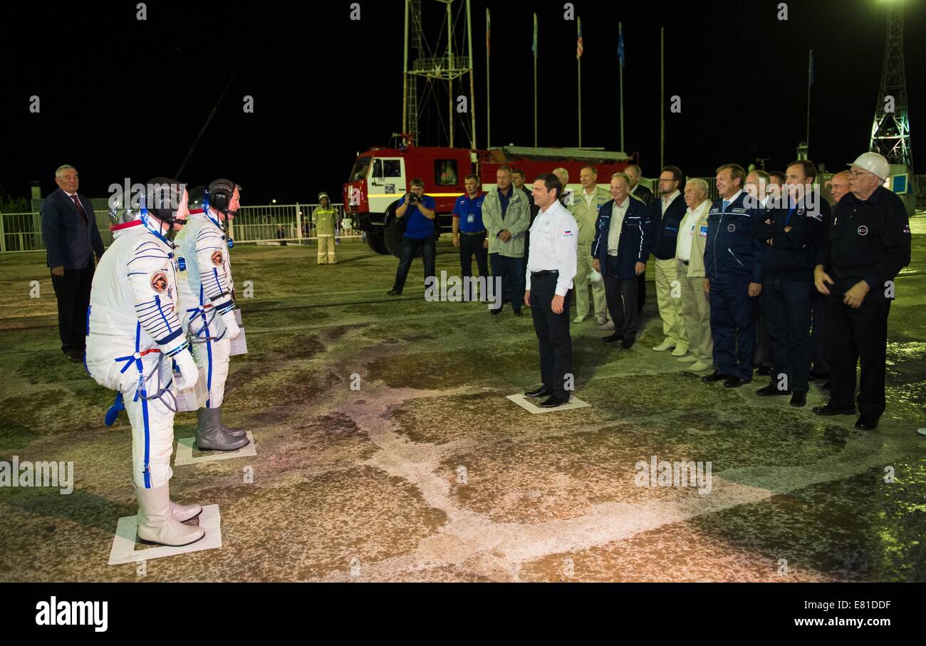 Oleg Ostapenko, General Director of the Russian Federal Space Agency greets International Space Station Expedition 41 crew members before they board for launch aboard the Soyuz TMA-14M spacecraft to the International Space Station September 25, 2014 in Baikonur, Kazakhstan. Samokutyaev, Serova and Wilmore will spend the next five and a half months living and working aboard the ISS. Stock Photo