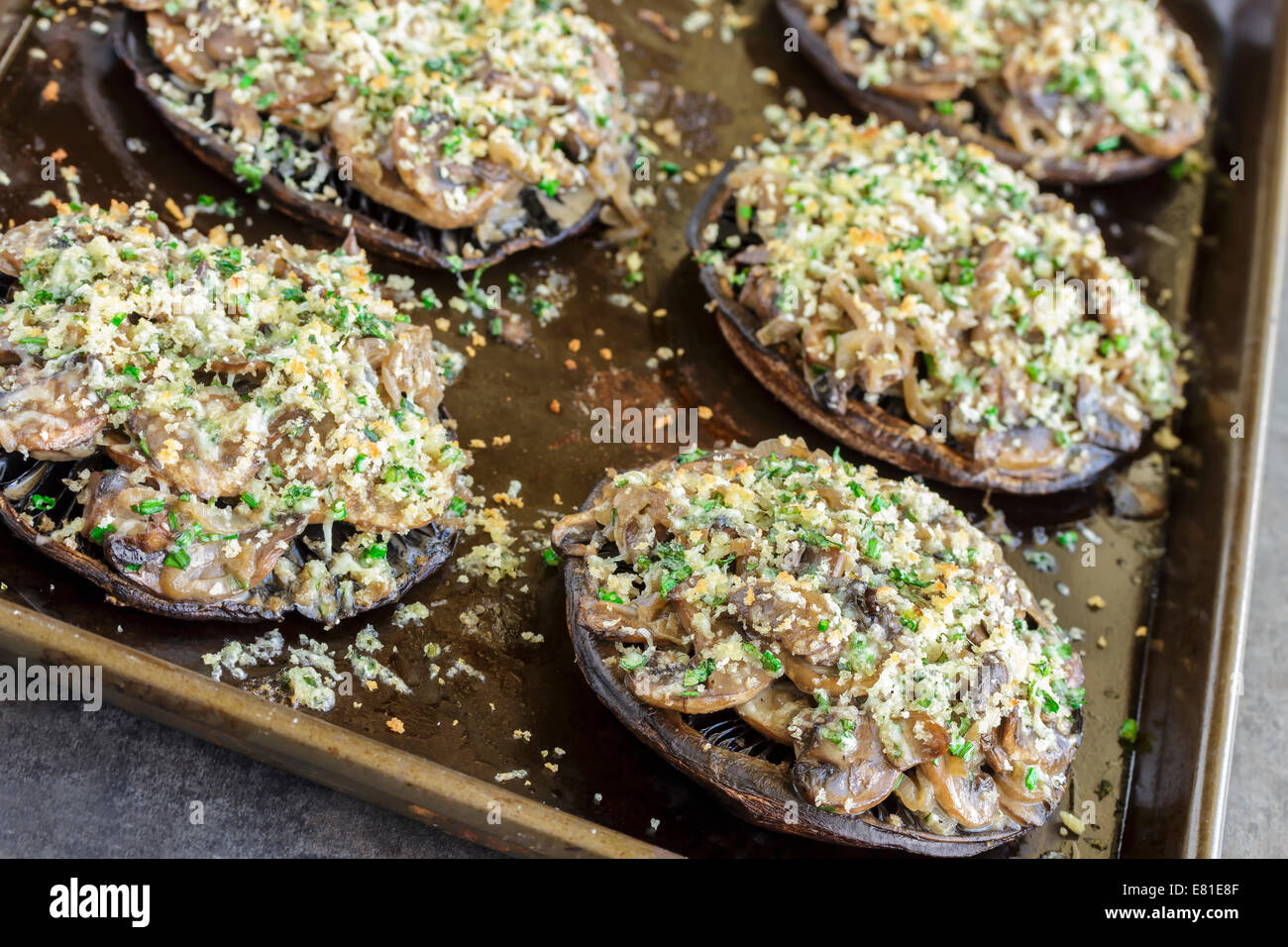 Portobello mushroom filled with shallots and cremini mushroom in a