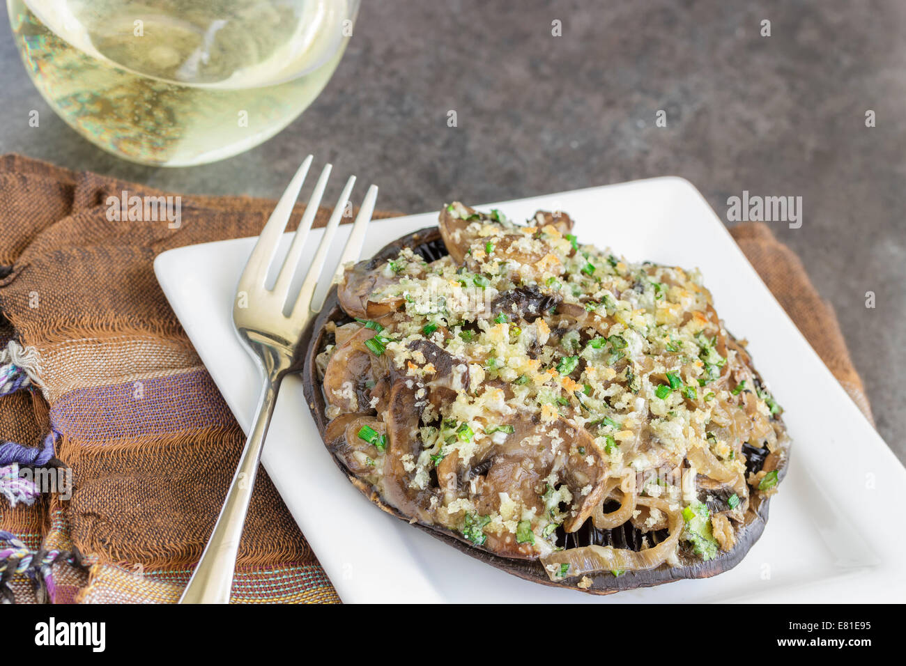 Portobello mushroom filled with shallots and cremini mushroom in a