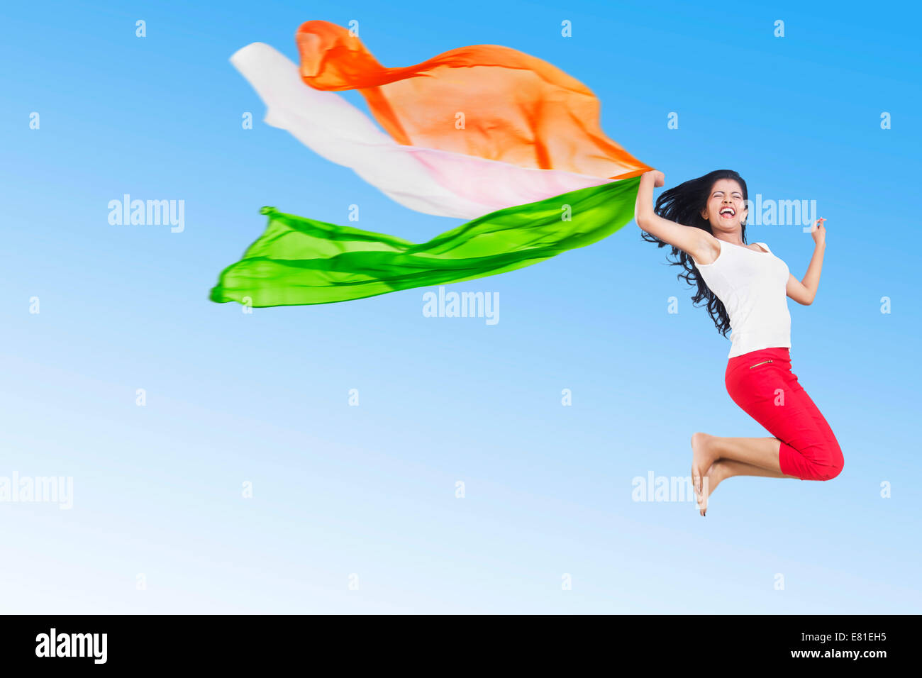 indian Patriotic Girl Jumping park fun Dupatta Stock Photo