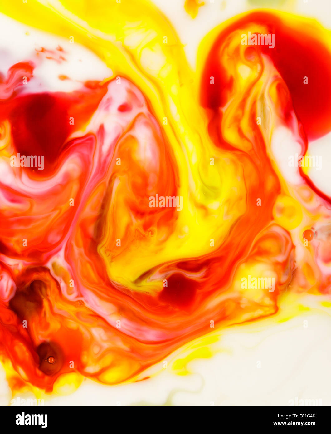 food coloring on milk abstract background Stock Photo