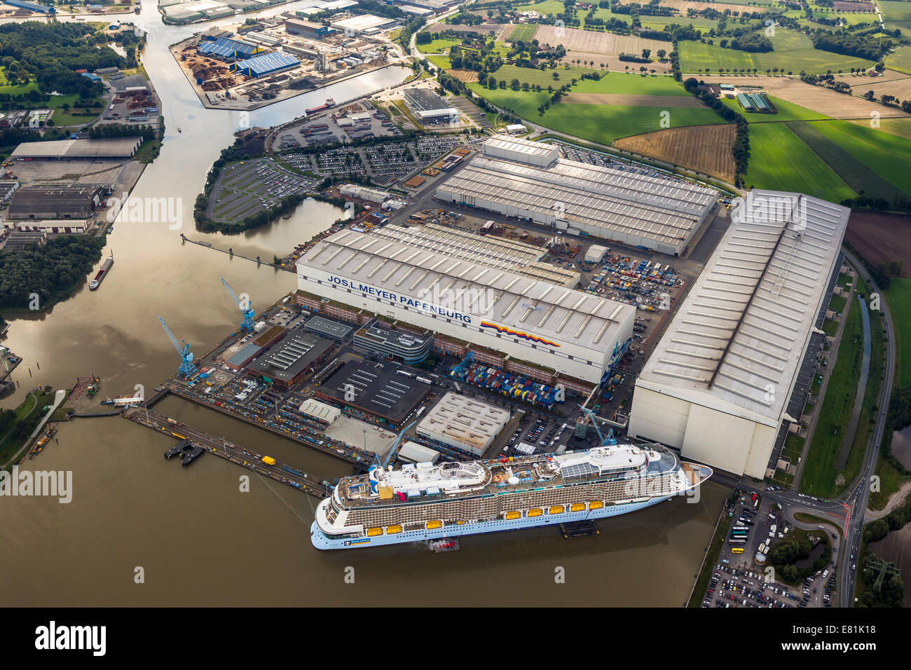 Aerial view, Papenburg Emshaven port with Jos. L. Meyer Werft shipyard and the cruise ship Quantum of the Seas, Royal Caribbean Stock Photo