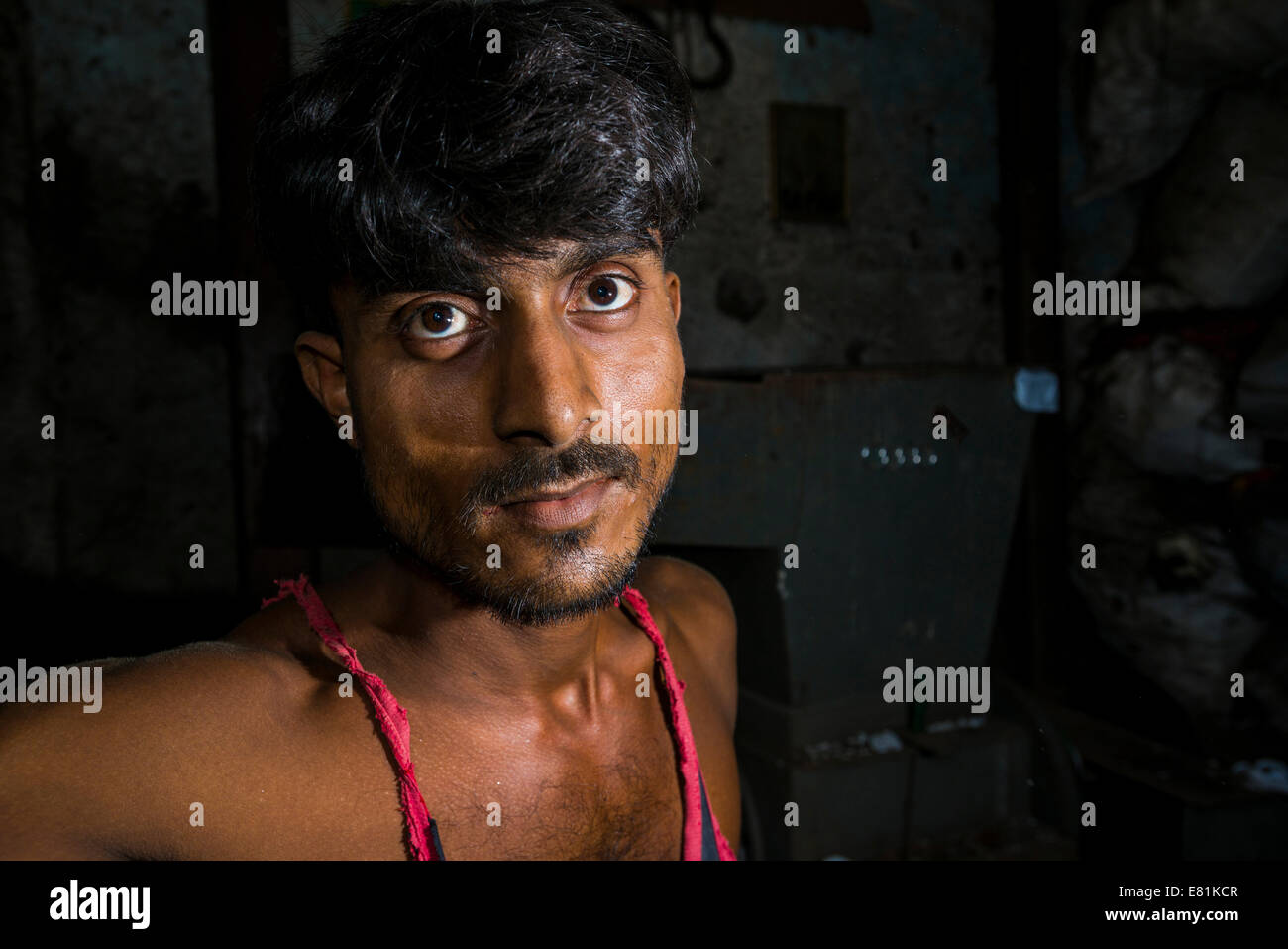 Portrait of a worker, Dharavi Slum, Mumbai, Maharashtra, India Stock Photo